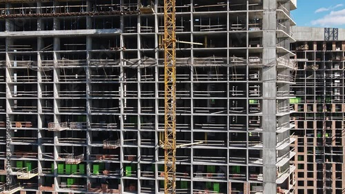 Aerial view of construction of tall residential buildings. Real estate in modern cities.