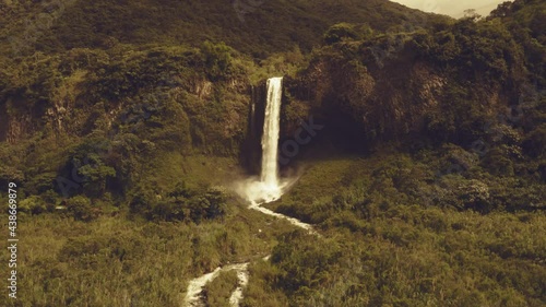 Zooming in on a large and stunning waterfall of more than 60 meters height with a warm filter
