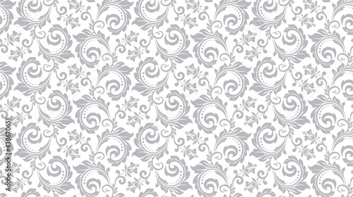 Wallpaper in the style of Baroque. Seamless vector background. White and gray floral ornament. Graphic pattern for fabric, wallpaper, packaging. Ornate Damask flower ornament.