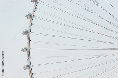 Canvas Print Close-up details of the Ferris wheel with metal beam guides and passenger booths