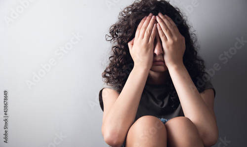 depressed woman hand close face