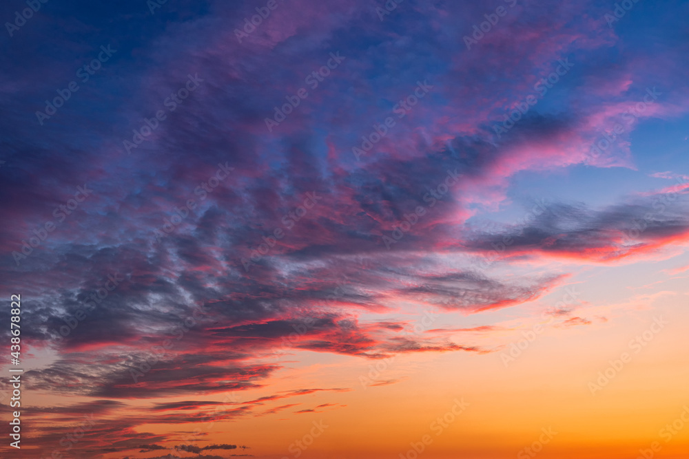 Colorful and vibrant cloudscape view of majestic sky at sunset or sunrise. Dramatic and idyllic background