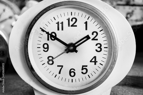  black and white clock, alarm clock,Old Vintage antique clock, Retro styled clock, time concept. Close-up. Black and white classic photo