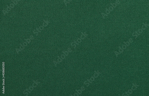 Texture of natural green twill fabric close-up. background for your mockup photo