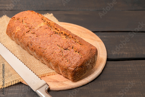 Rye bread on dark wooden table with copy space