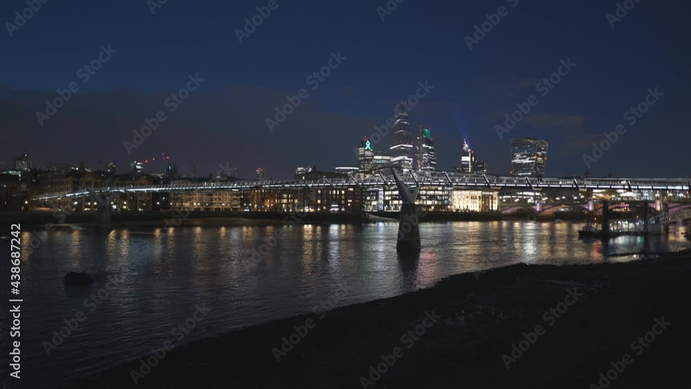 A view of a pedestrian bridge at night. A view of a pedestrian bridge at night.