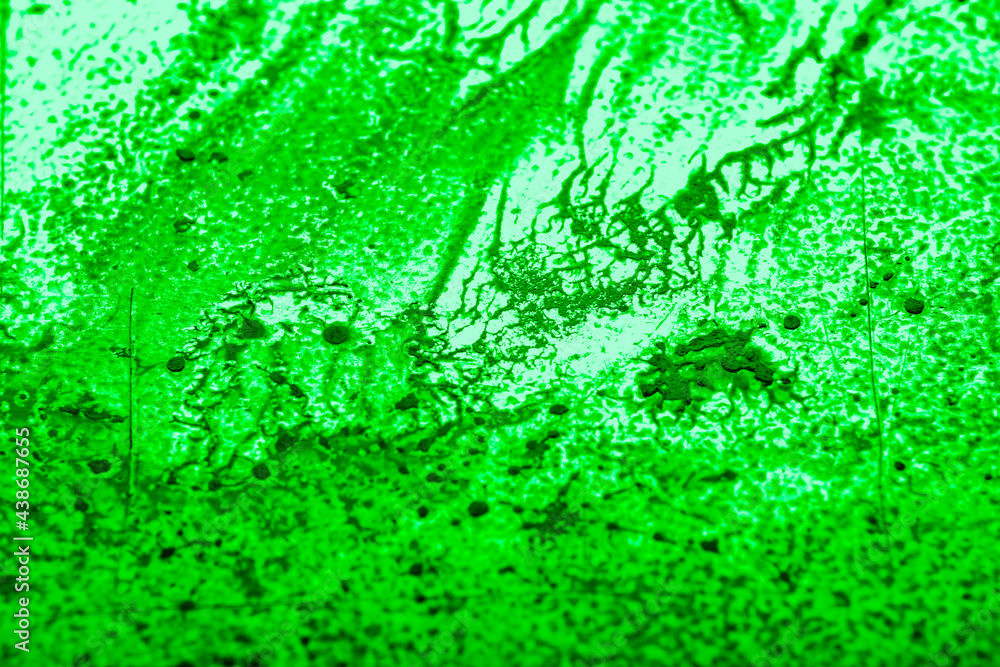Paint spilled and smeared over a textured plastic surface. Light overlay pattern with dried paint texture. Blurred image at an angle Paint spilled and smeared over a textured plastic surface. Light overlay pattern with dried paint texture. Blurred image at an angle