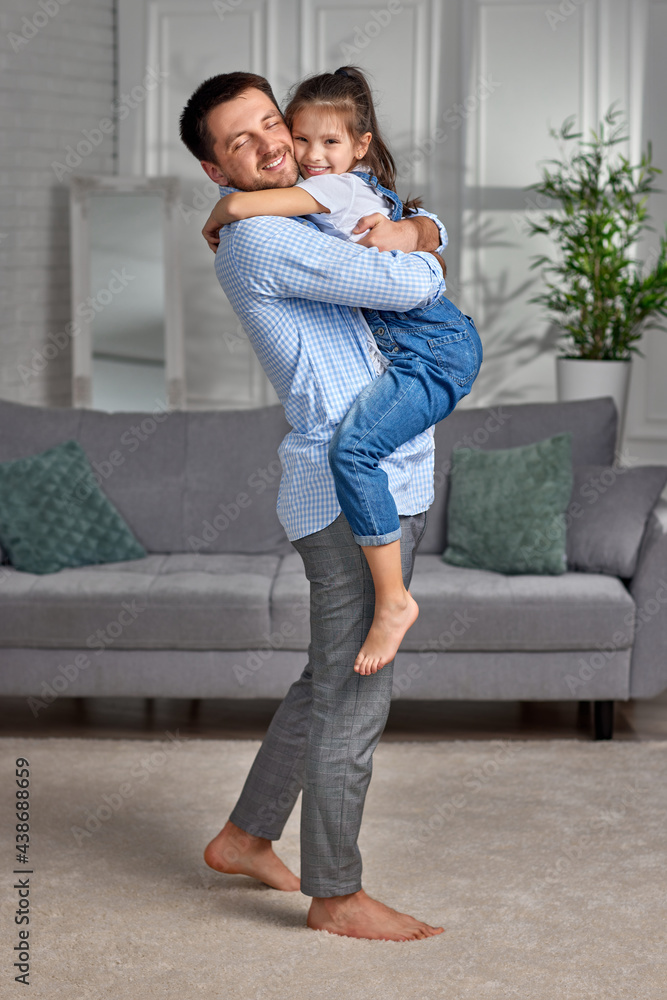 smiling father hugging his cute little child daughter. smiling father hugging his cute little child daughter.