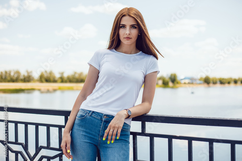 Young woman in white t-shirt. Mock-up. © kanashkin