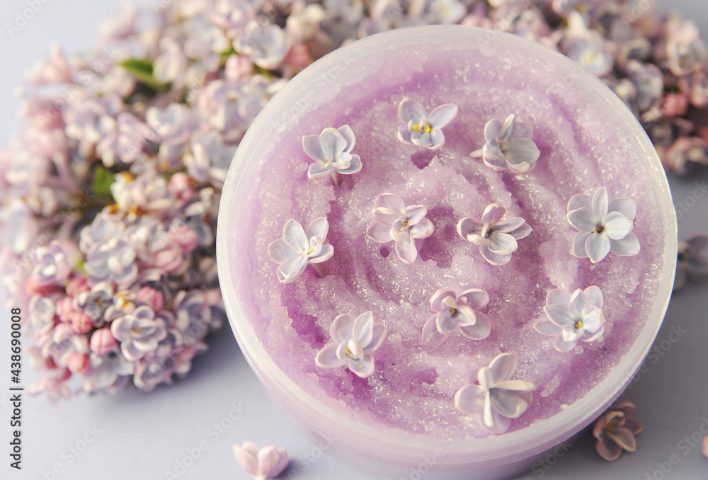 Violet scrub for body with lilac on light background Violet scrub for body with lilac on light background