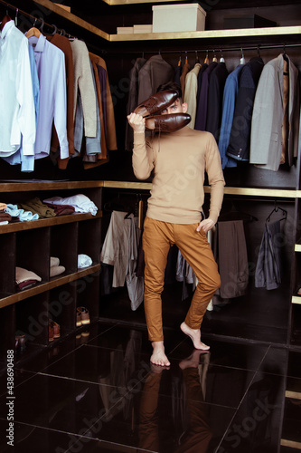 Elegant look. Handsome man in a beige suit standing. Styles, trendy, men's wardrobe.
