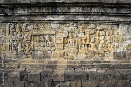 Bas-relief statue at Borobudur, a 9th-century Mahayana Buddhist temple in Central Java photo