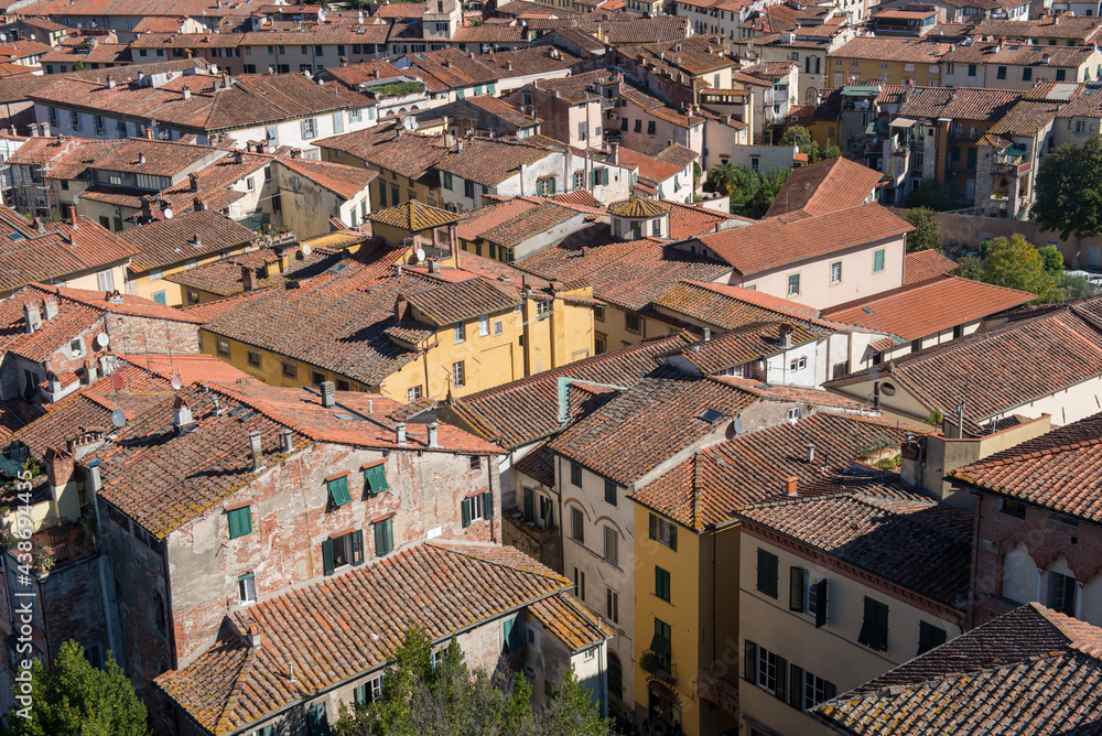 Cityscape with rooftops from Torre Ginigi tower Lucca town. Tuscany central Italy