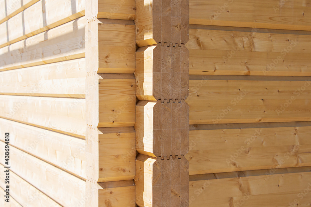 Fragment of a construction built of glued pine timber beams. Fragment of a construction built of glued pine timber beams.