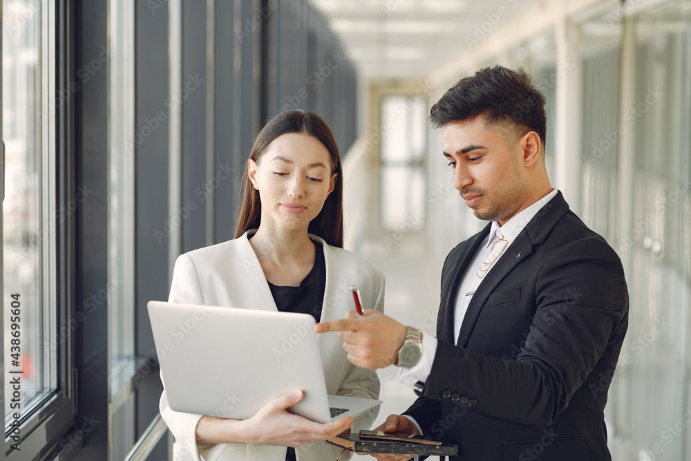 Businessman with his partner working in a office Businessman with his partner working in a office