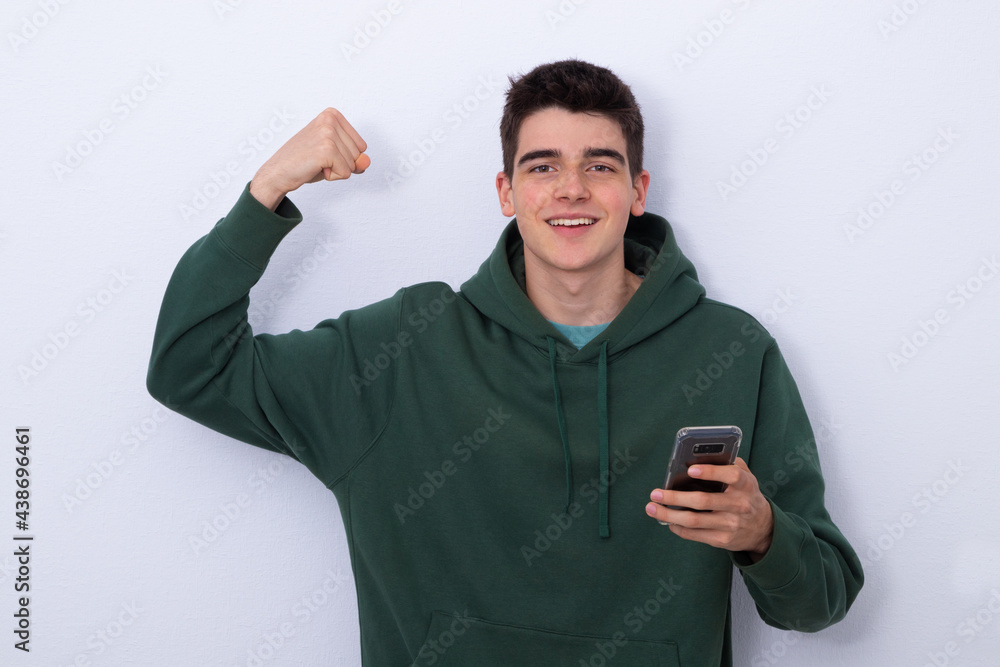 happy teenage student isolated with cell phone euphoric with success happy teenage student isolated with cell phone euphoric with success