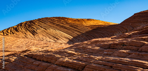 Waves of petrified sand dunes in Snow Canyon State Park, Utah photo