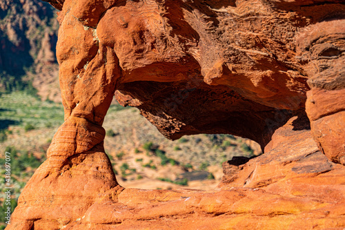 view through a natural arch in Snow Canyon State Park, Utah