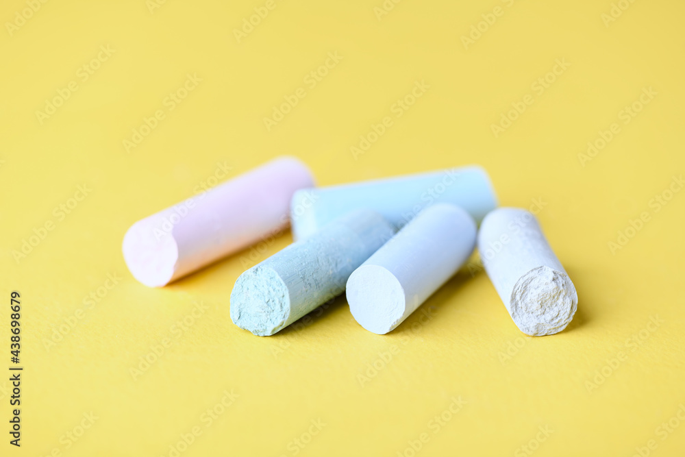Soft pastels on yellow background. Close up. Copy space. Soft pastels on yellow background. Close up. Copy space.