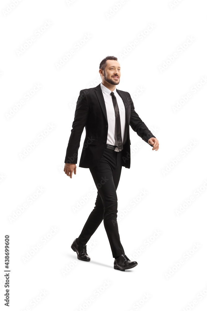 Full length portrait of a young businessman walking fast Full length portrait of a young businessman walking fast