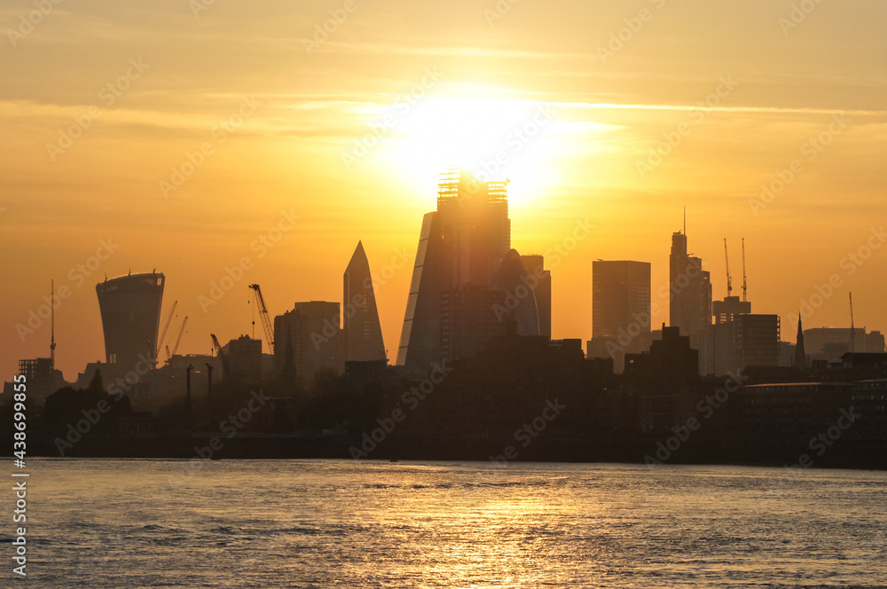 Sunset over the silhouette of City of London, England, United Kingdom, UK