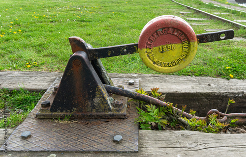 An old railroad switcher on abandoned railway in one of medieval cities in Sweden photo