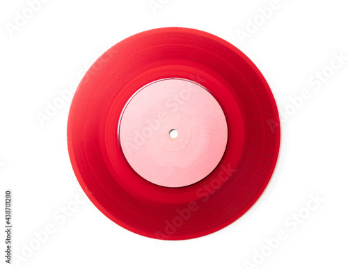 Early 1970s see through red single EP record or analog disc ( 45 rpm / 7 inch), isolated on white. High resolution, sharp to the edge. photo