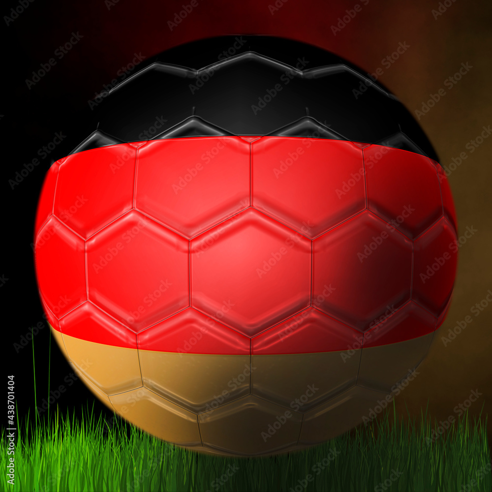 Fototapeta premium Soccer ball of the German team, on a black background above the grass