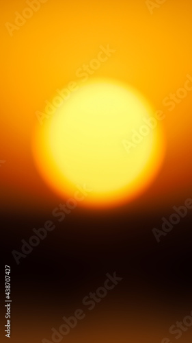 Beautiful blurred setting sun over the horizon as a background. Vertical image for mobile stories, smartphone wallpapers
