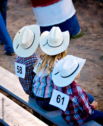 The young cowboys on the bench waiting to ride during adventures of The West Wyoming and the ranches.