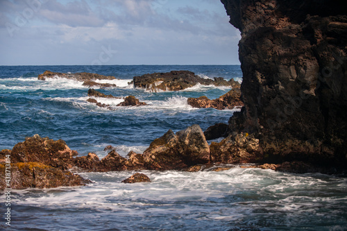 Waves hitting the rocks. Rocky cliffs on sea, seascape.