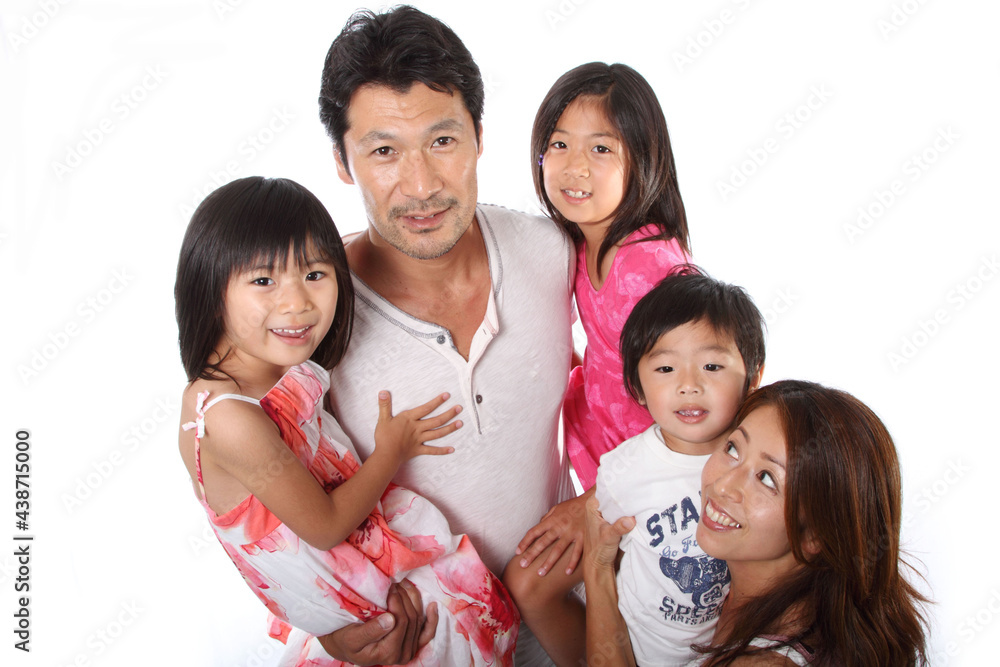 A happy Japanese family relaxing in the living room A happy Japanese family relaxing in the living room