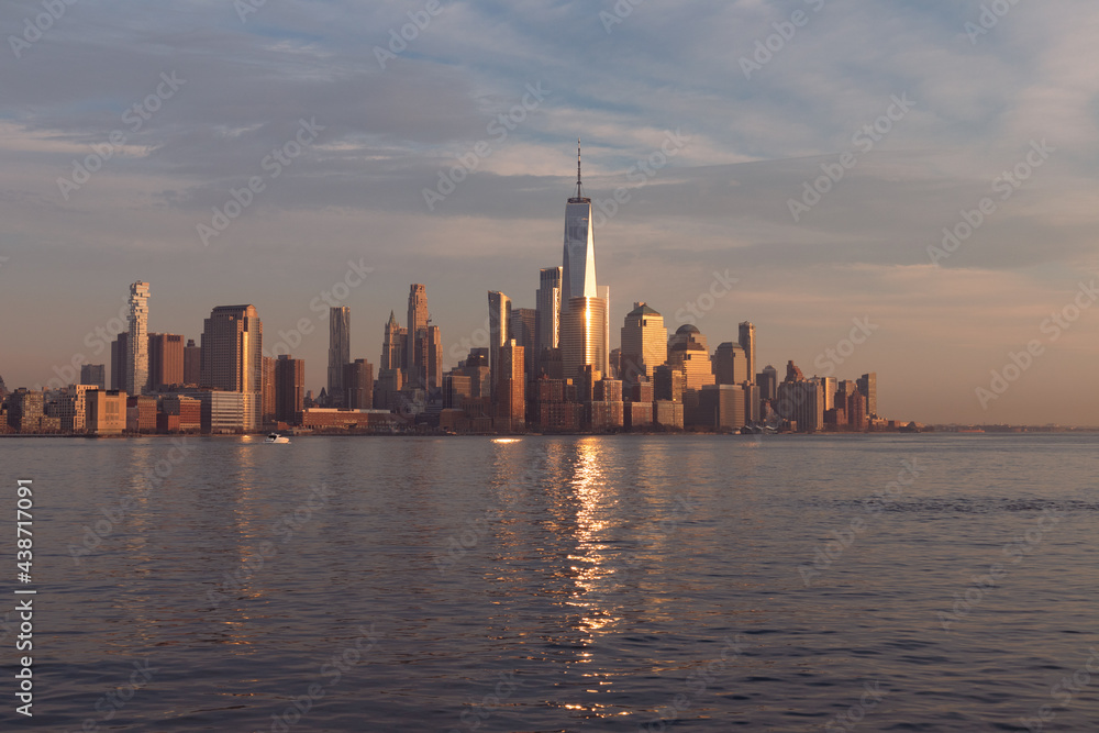 Beautiful Lower Manhattan Skyline Shining in the Sun during a Sunset in New York City along the Hudson River