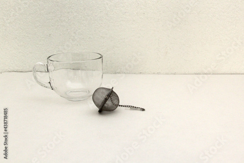 Tea making tools: infuser, glass cup, dry herb, spoon for relaxation and disease cure 
