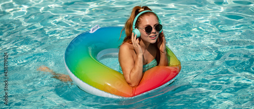 Summer mood concept. Pool resort. Girl on swim ring. Summertime days.