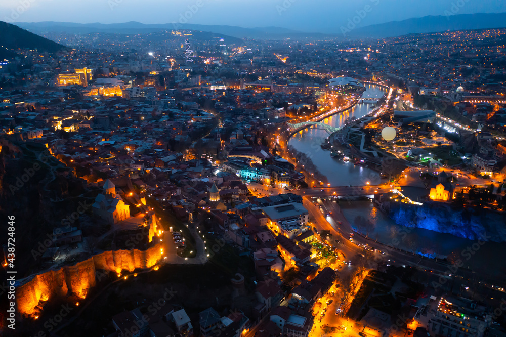 View from copter of illuminated center of Tbilisi city in the evening, Georgia