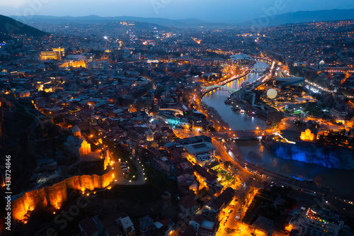 View from copter of illuminated center of Tbilisi city in the evening, Georgia © JackF