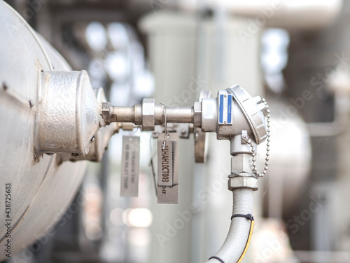 Temperature sensor for measuring instrument close up in industry zone at power plant.