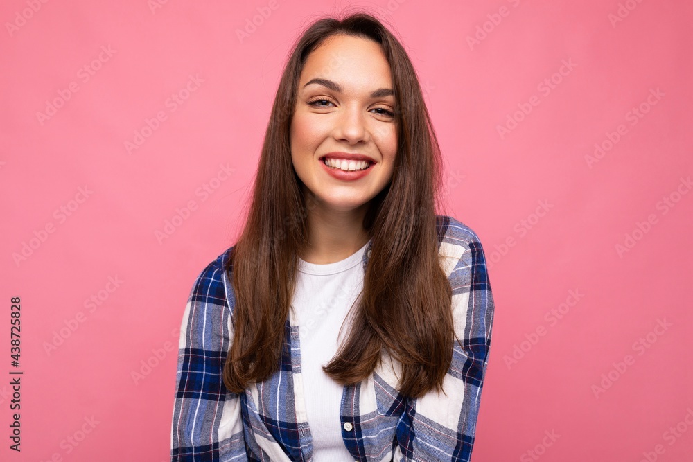 Portrait of positive cheerful fashionable woman in hipster outfit isolated on pink background with copy space Portrait of positive cheerful fashionable woman in hipster outfit isolated on pink background with copy space
