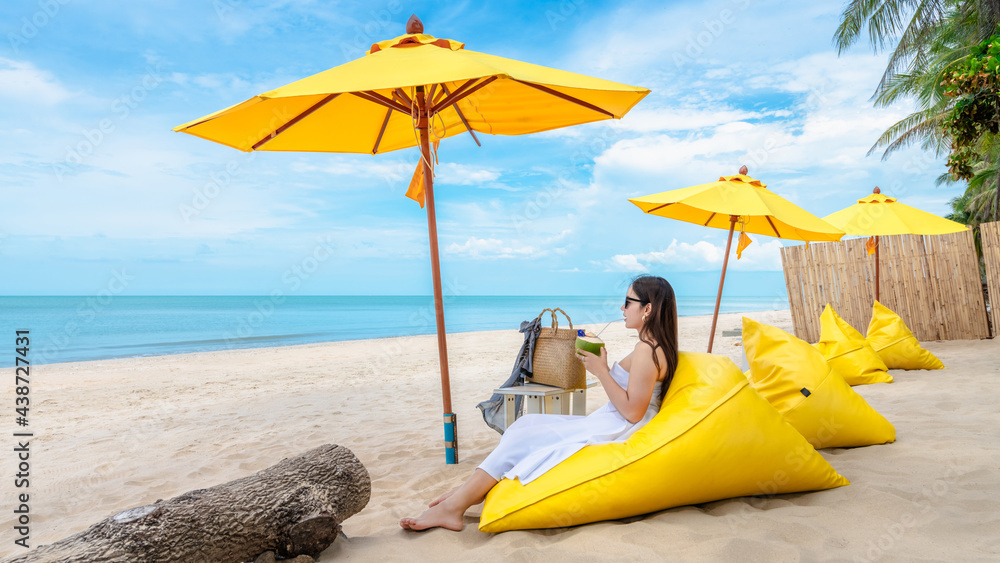 Summer lifestyle traveler woman relaxing on bean bag beach chair in front  of vacation exotic beach, Attraction place leisure tourist travel Thailand  holiday trip, Tourism beautiful destination Asia Stock Photo | Adobe