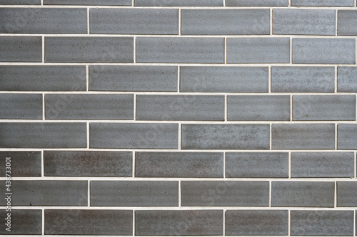 Background from a wall made of grey clinker bricks