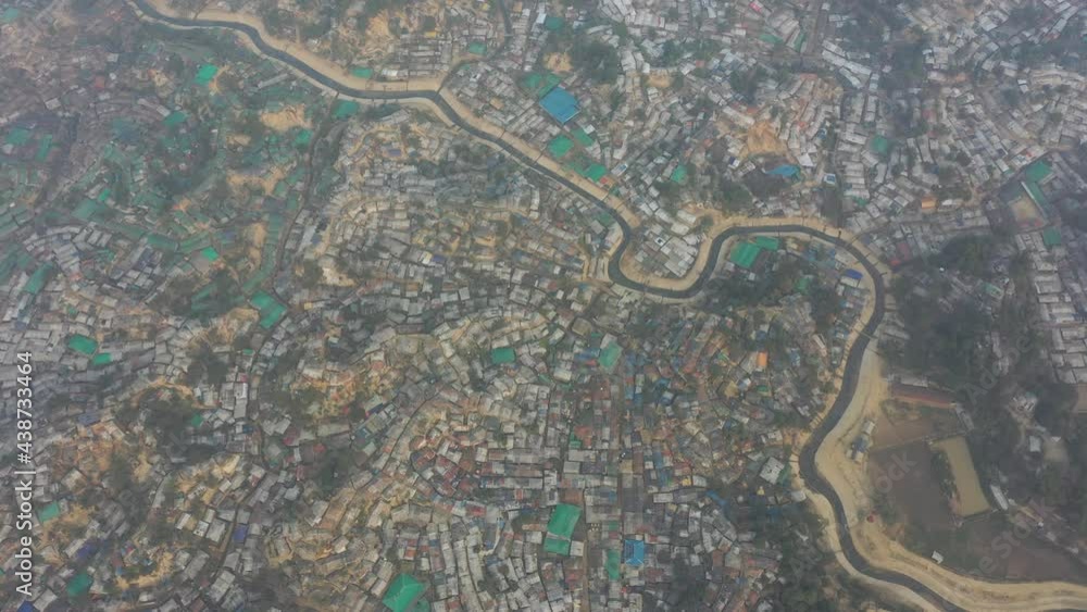 Aerial view of a huge refugee camp with makeshift houses near Myanmar border, Kutupalong Rohingya camp near Ukhia town, Bangladesh. Aerial view of a huge refugee camp with makeshift houses near Myanmar border, Kutupalong Rohingya camp near Ukhia town, Bangladesh.
