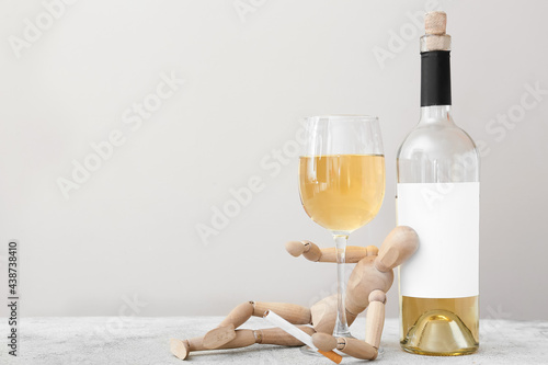 Wooden mannequin with cigar...
