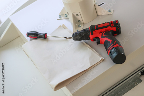 Wallpaper Mural Cordless screwdriver on wood table assembly furniture concept Torontodigital.ca