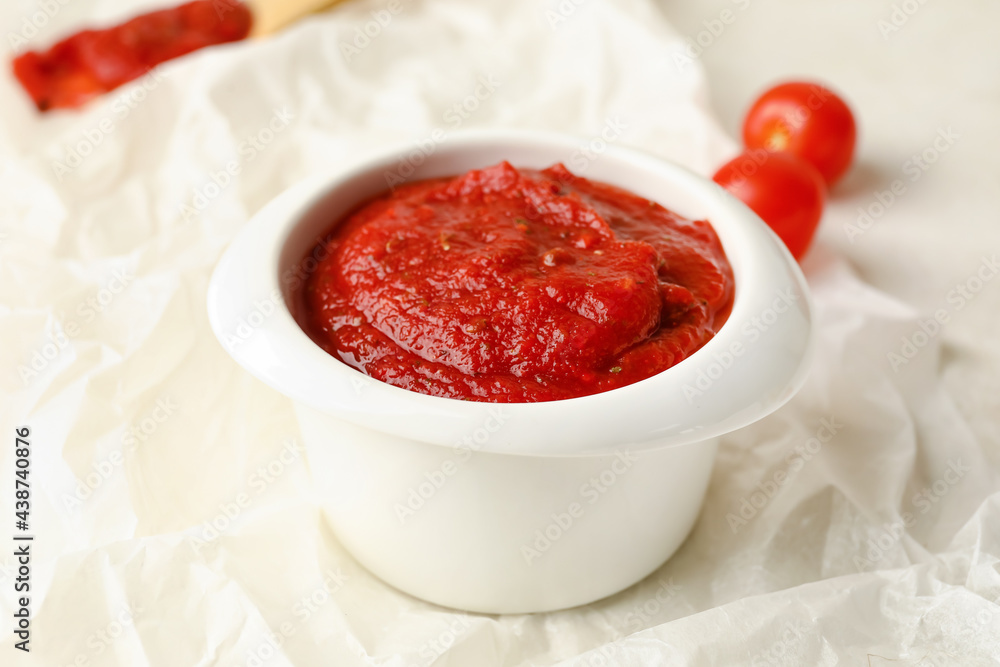 Bowl of tasty sauce on light background, closeup Bowl of tasty sauce on light background, closeup