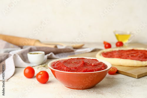 Pizza dough with tasty toma...