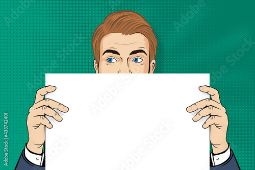 Pop art blonde man. Man with blue eyes holding blank paper. Retro halftone background in comic style with open space. Stock vector illustration for invitation or poster design.