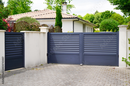 modern wicket and grey gate of home aluminum portal suburb door in house photo