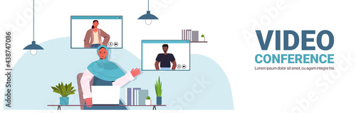 arab businesswoman chatting with mix race colleagues during video call business people having online conference