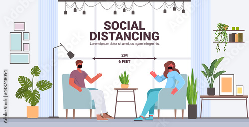 couple discussing in protective masks man woman keeping distance to prevent coronavirus social distancing
